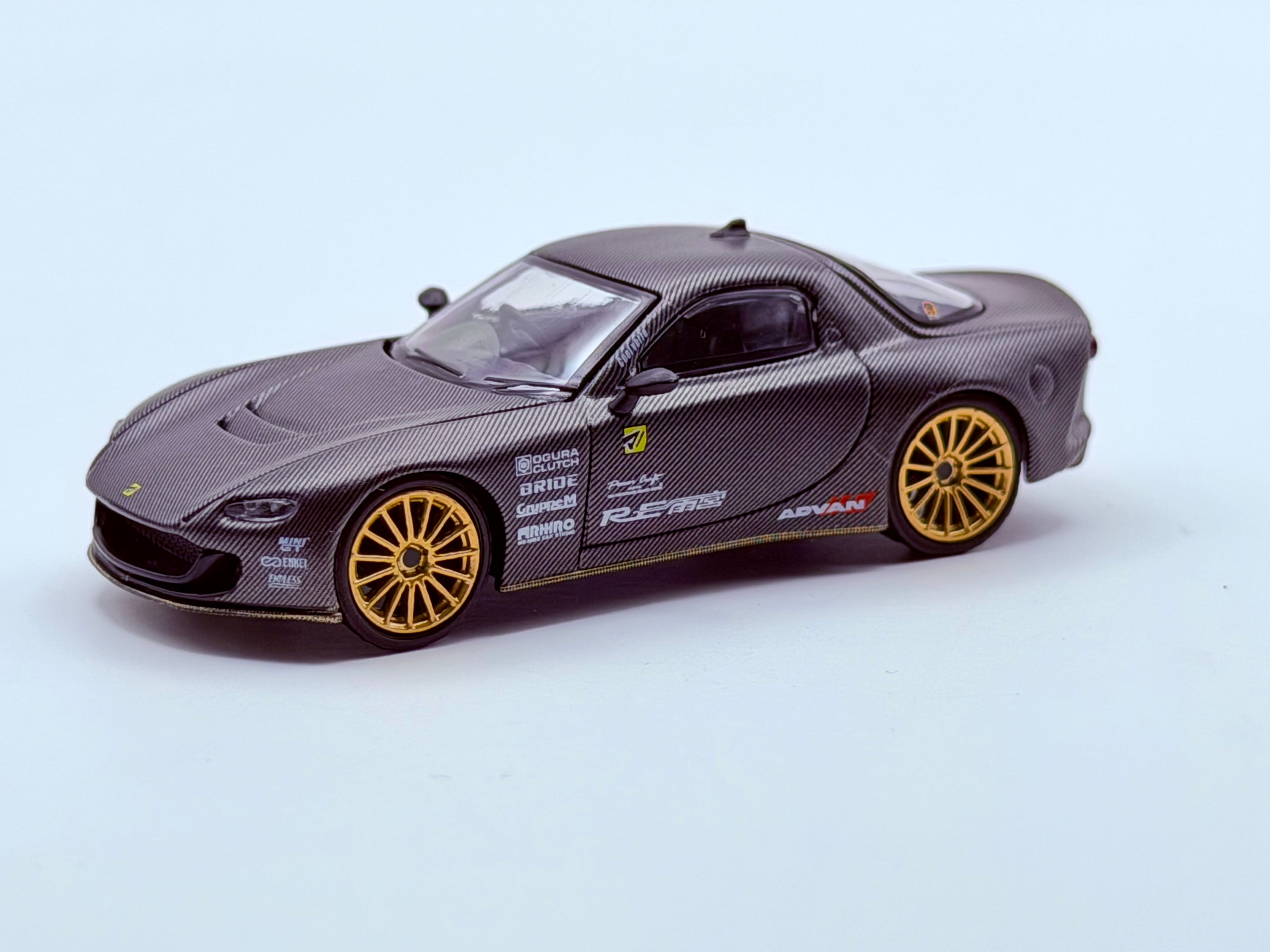 Mini GT 1:64 Mazda RX-7 RE-Amemiya Matsukiyo KOKU 3 Rotor NA-7 TAS 2025 Best Tuned Car Award – Carbon #1205