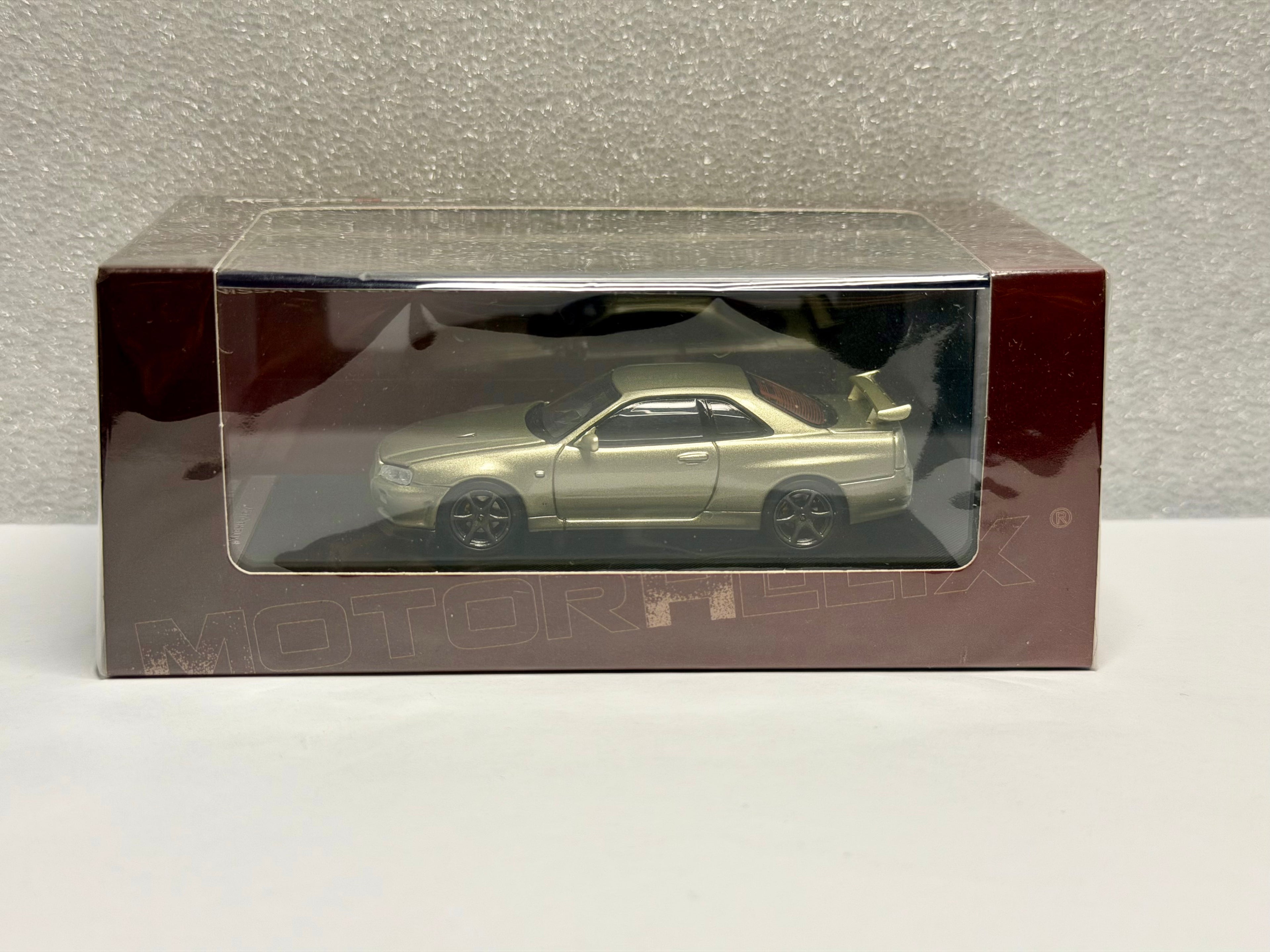 Motorhelix 1/64 日産 GT-R R34 VスペックII ダイキャスト (ベイサイドブルー/ジェイド)