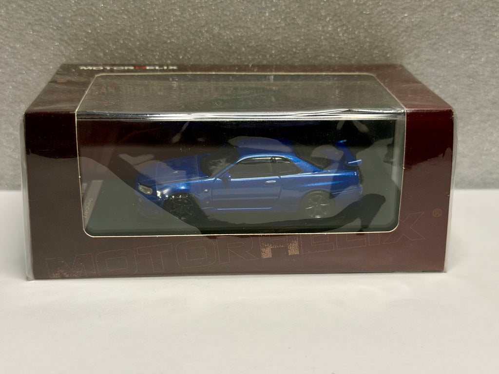 Motorhelix 1/64 Nissan GT-R R34 V Spec II Fundición (Azul Bayside/Jade)