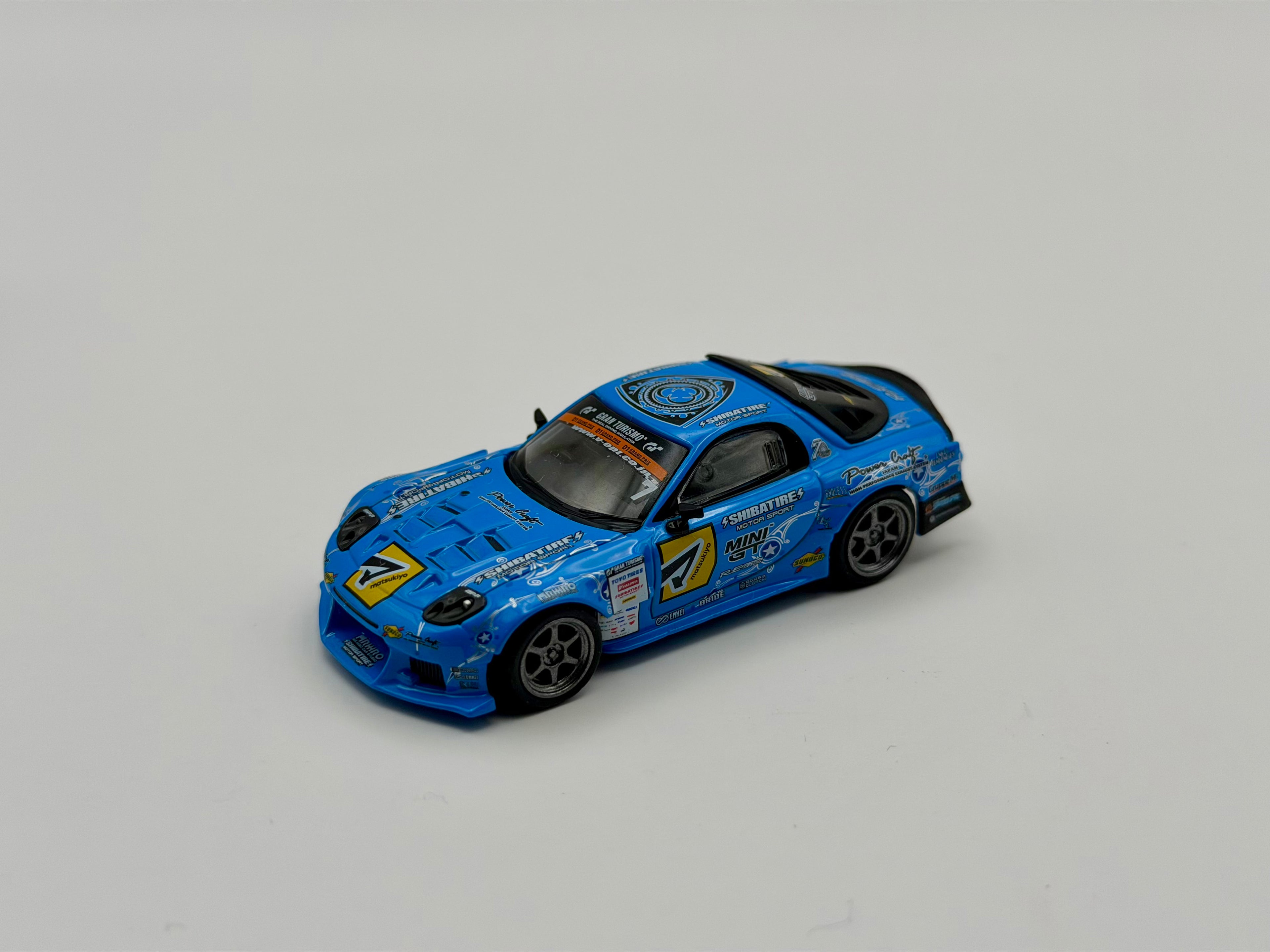 Mini GT 1:64 Mazda RX-7 RE-Amemiya 2025 D1GP – Blue #1195