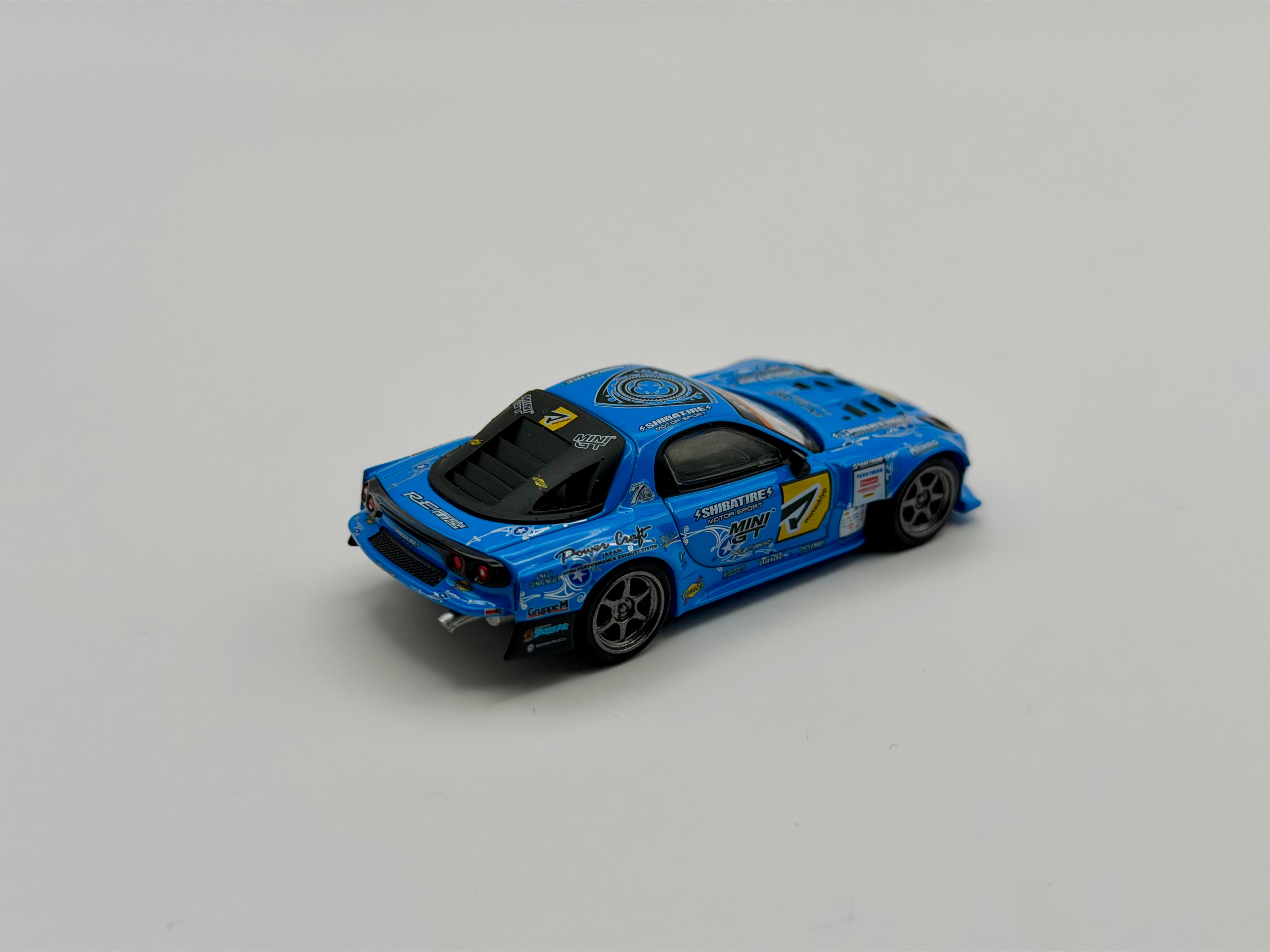 Mini GT 1:64 Mazda RX-7 RE-Amemiya 2025 D1GP – Blue #1195