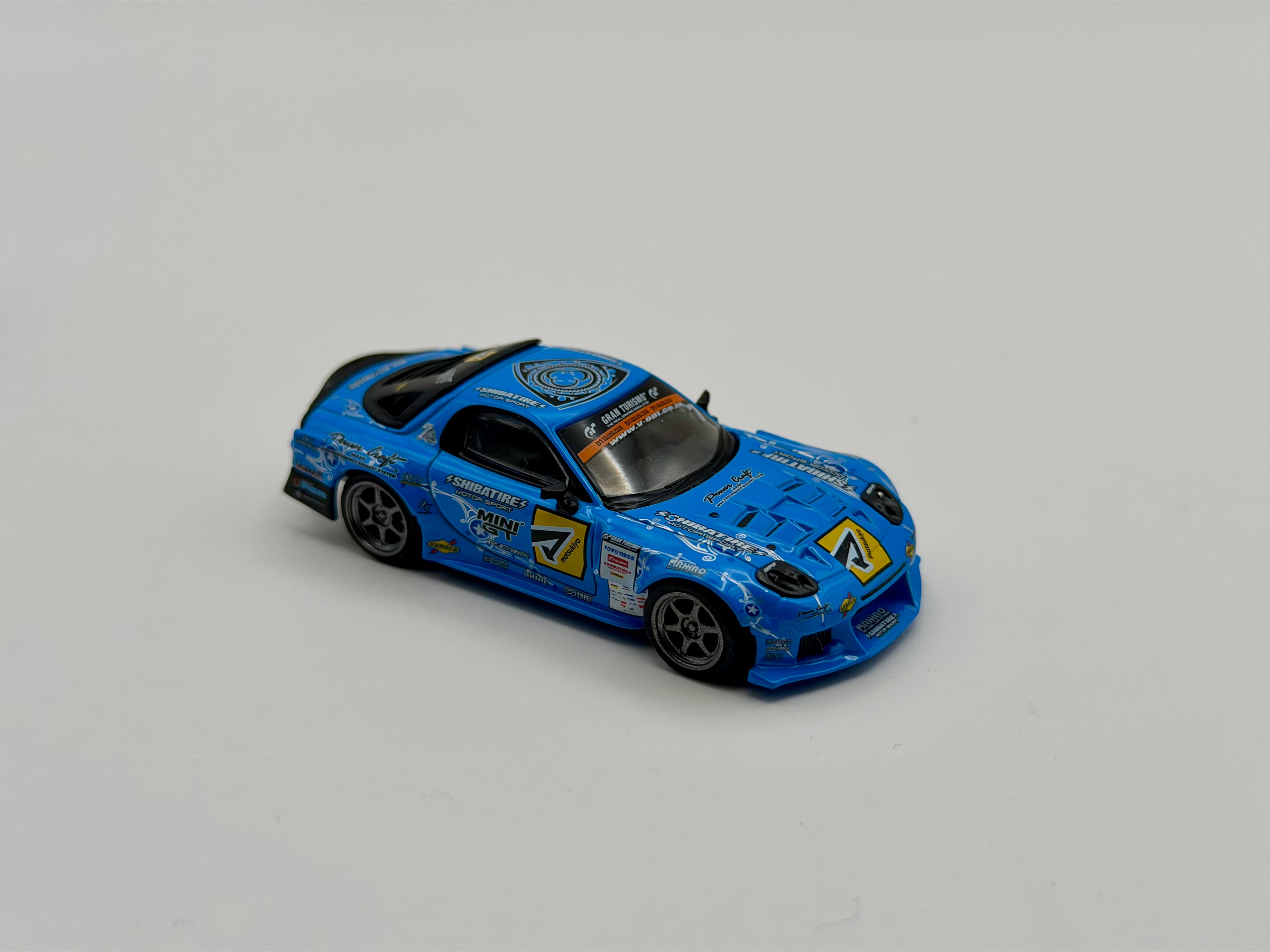 Mini GT 1:64 Mazda RX-7 RE-Amemiya 2025 D1GP – Blue #1195